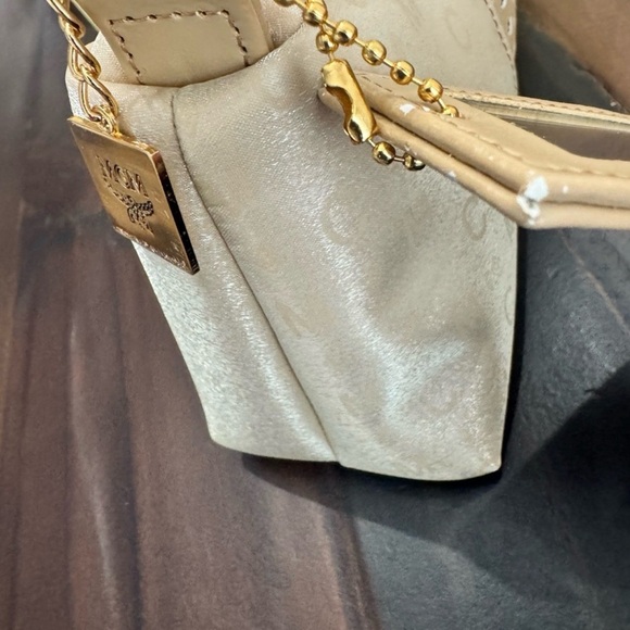 MCM Mini Top Handle Bag
Champagne Monogram Leather - Picture 8 of 15